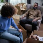 Home Couple discussing with box on floor 150x150 - Home
