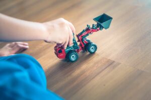 Kid playing truck toy 300x199 - Kid playing truck toy