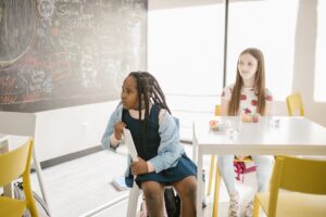 two girls looking at the board 300x200 - two girls looking at the board