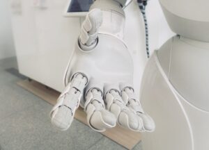 white robot hand outstretched 300x216 - white robot hand outstretched