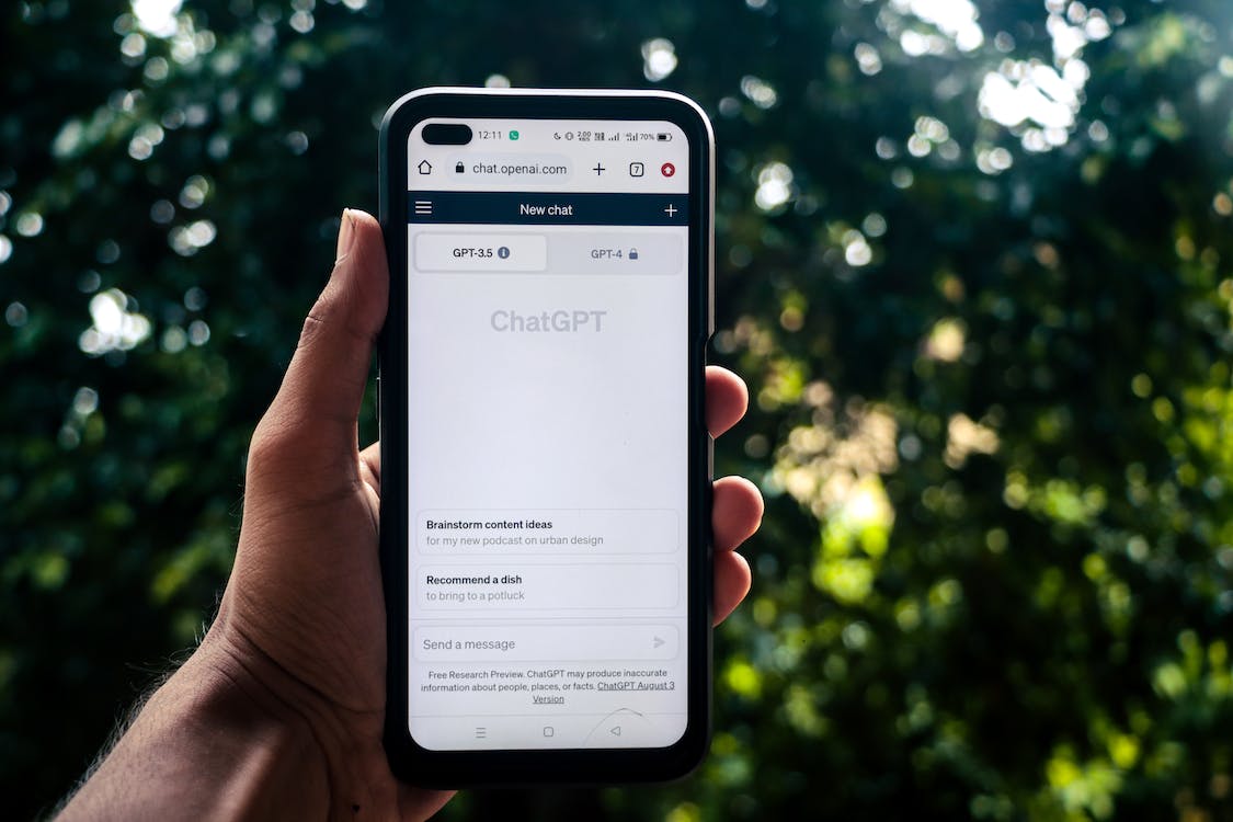person using chatgpt outdoors - 7 Ways to Streamline Work With ChatGPT