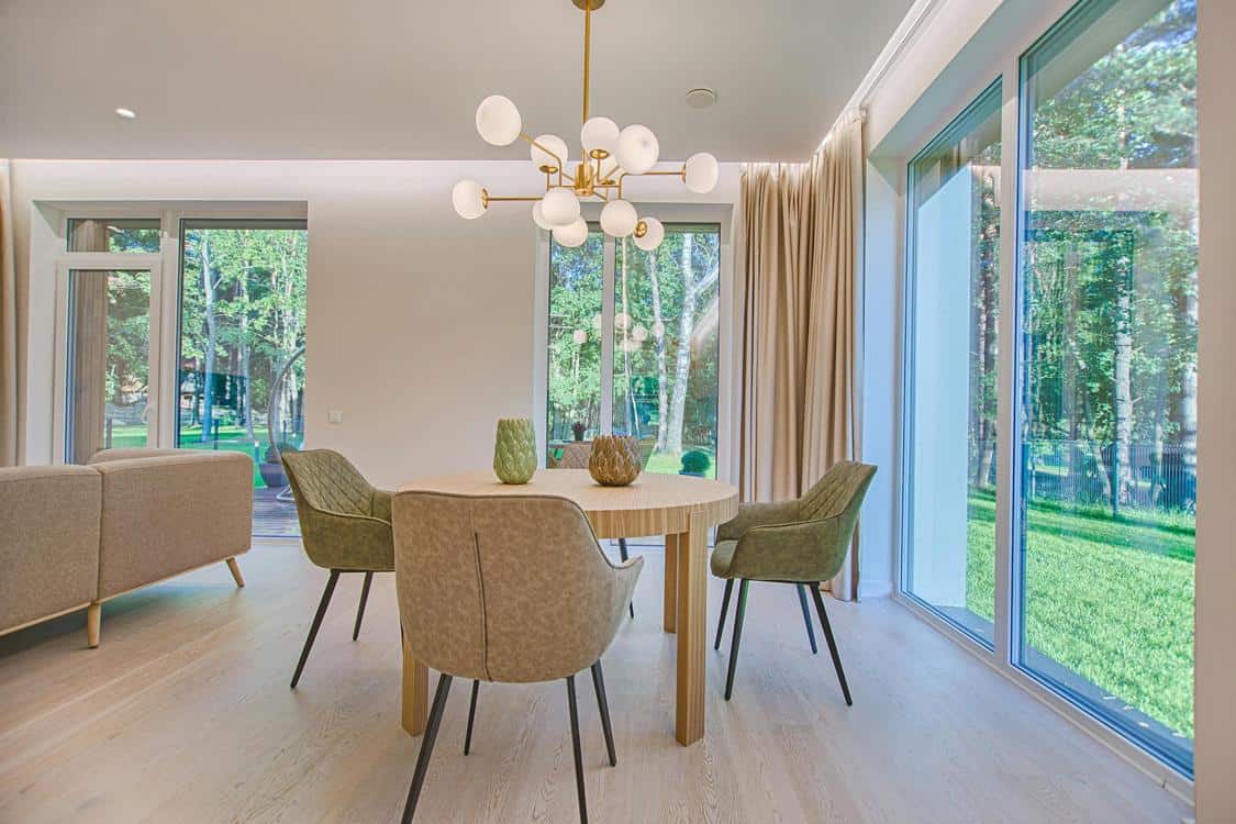 round brown wooden 5piece dining set in room - How to Use Lighting to Transform Your Living Spaces