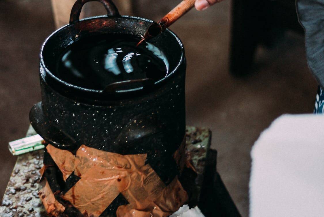 a black container with dye - A Visual Guide to Interpreting Southeast Asian Batik Styles