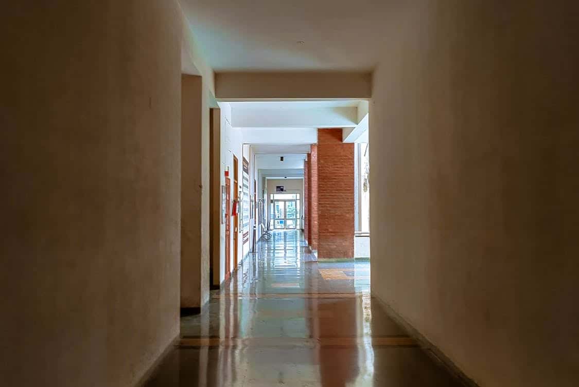 Empty Corridor with White Walls - Essential Features of a Quality Epoxy Floor System