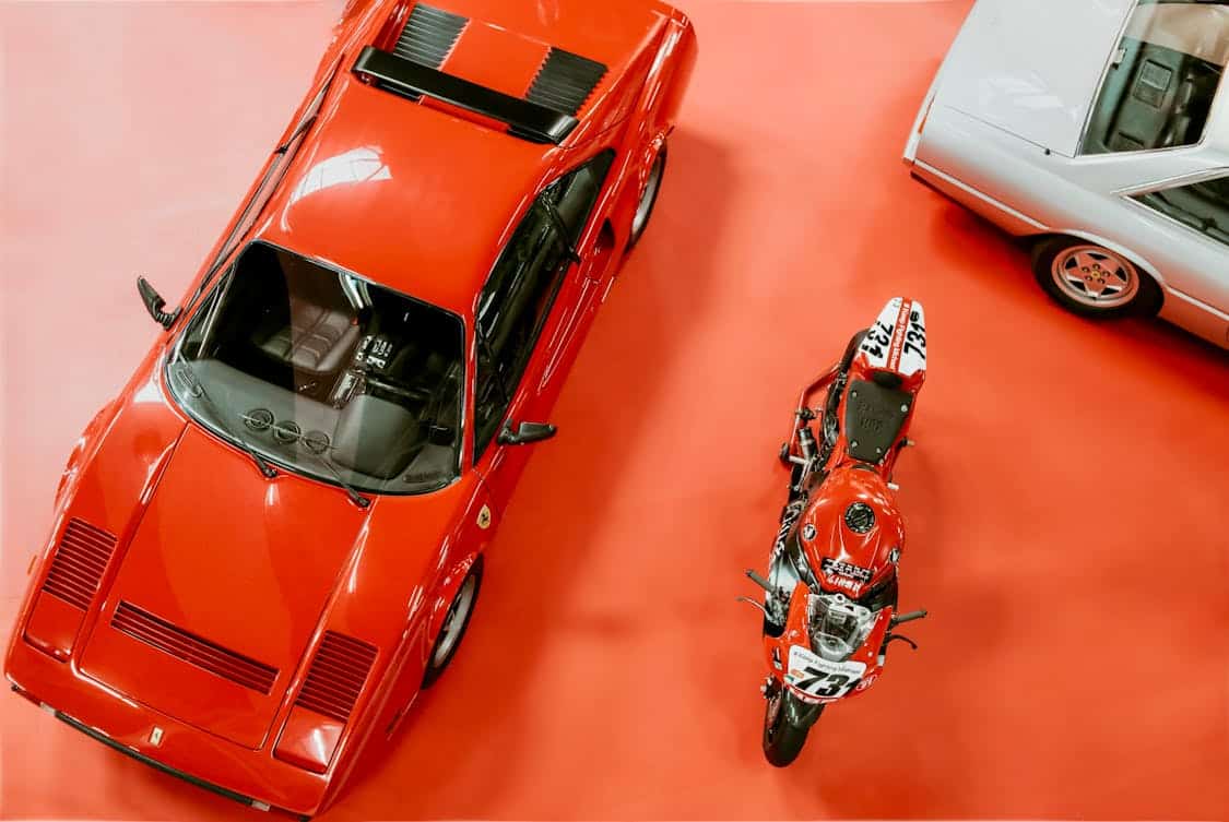 Vintage Sportscar and Motorcycle in a Show Room - Why Epoxy Fits Both Modern And Traditional Garages