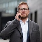 A Businessman on a Phone Call 150x150 - Home