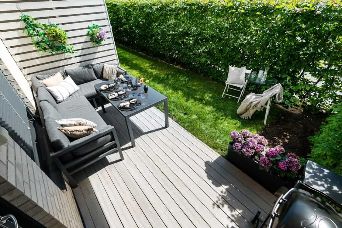 Photo of a Modern Furnished Patio - 5 Expert Tips for Choosing Timber Deck Materials Wisely