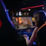 a woman playing a video game 150x150 - Home