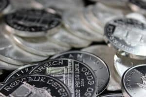 silver coins on a black surface 300x200 - silver coins on a black surface