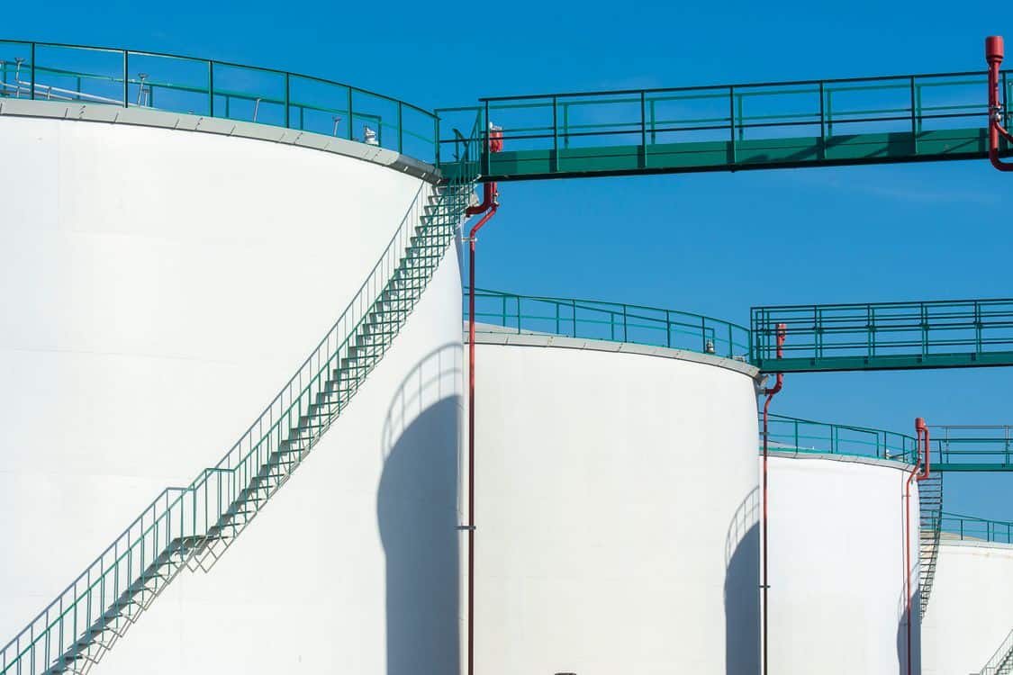 Large industrial storage tanks with a green walkway - Home