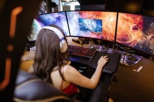 a girl gamer with multiple screen setup 300x200 - a girl gamer with multiple screen setup