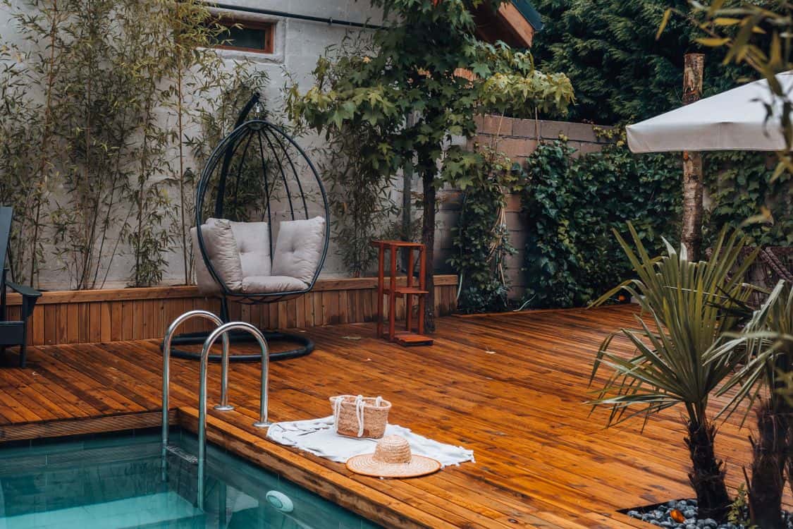backyard with wooden deck and pool - How the 2026 Water Supply Picture Is Reshaping Tropical Yards Across San Diego County