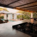 Modern outdoor kitchen overlooking a poolside setting 150x150 - Home